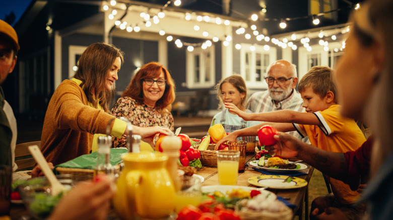 Family enjoying an outdoor meal at home