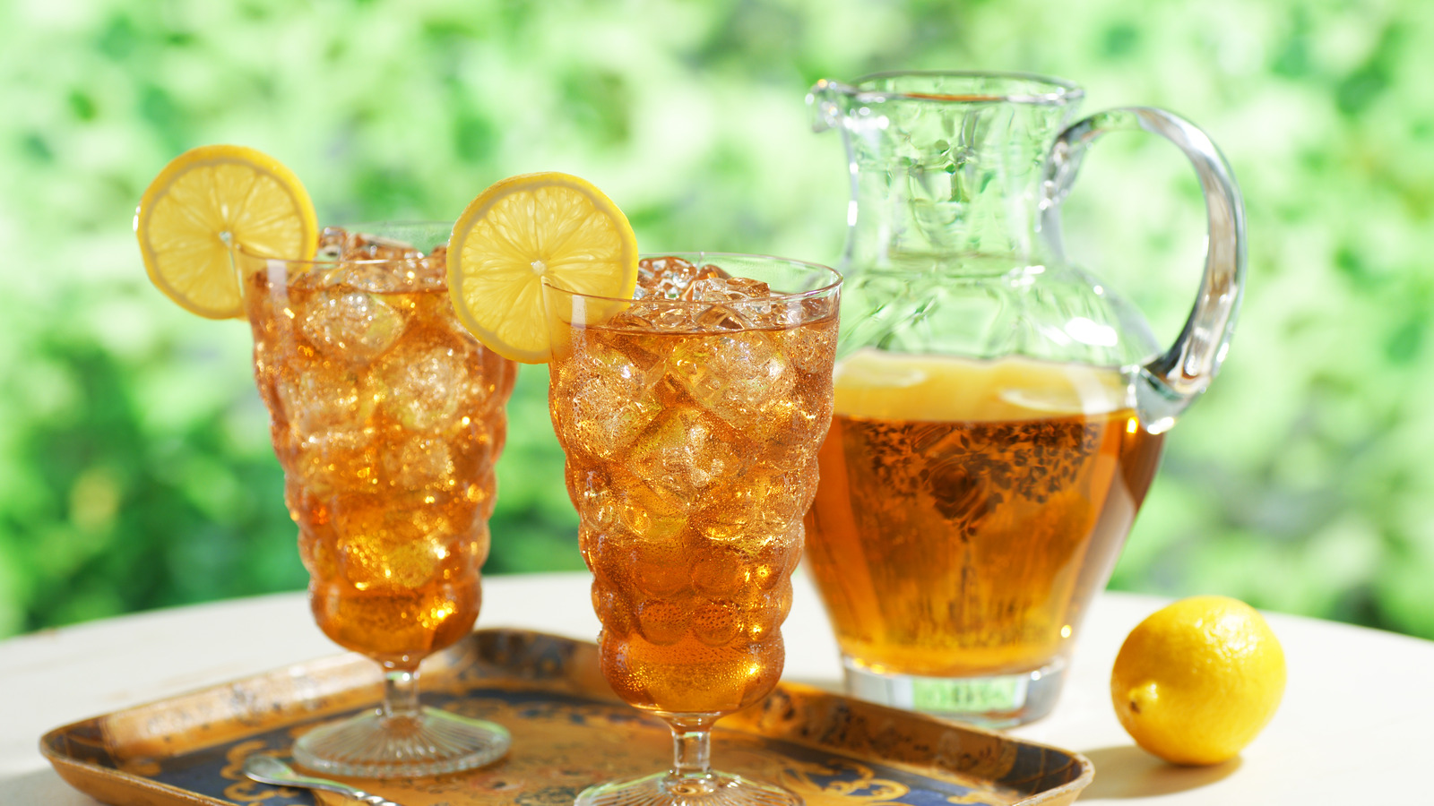 The Flavorful Additions To Sweeten Iced Tea Without Plain Sugar