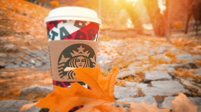 starbucks drink with fall leaves