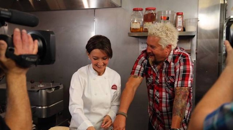 Guy Fieri with a chef being filmed on "Diners, Drive-Ins, and Dives"