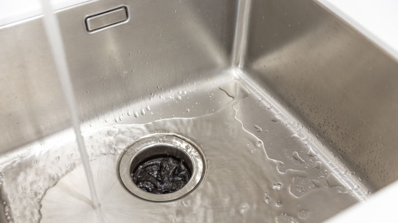 Water running in a stainless steel sink