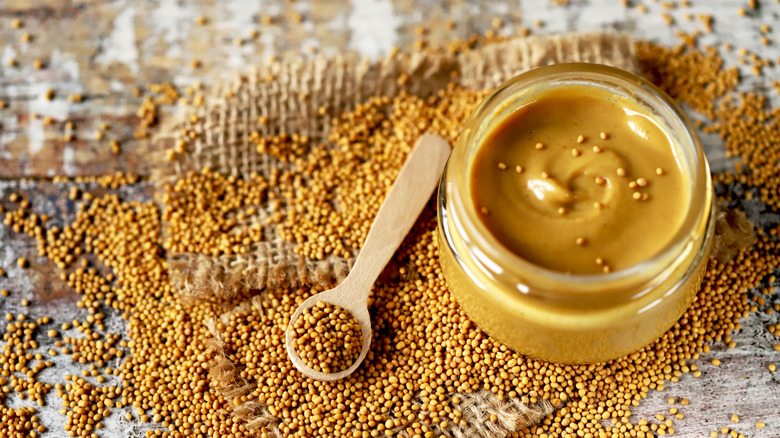 mustard seeds and mustard jar