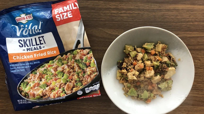 A bag of Birds Eye Chicken Fried Rice beside a prepared plate of it