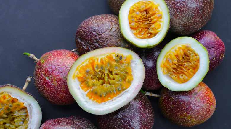 Whole and halved passion fruits