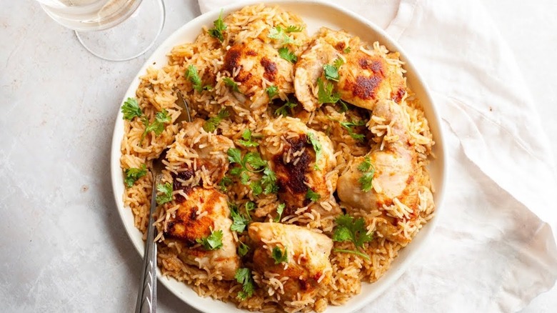 chicken and rice in white bowl