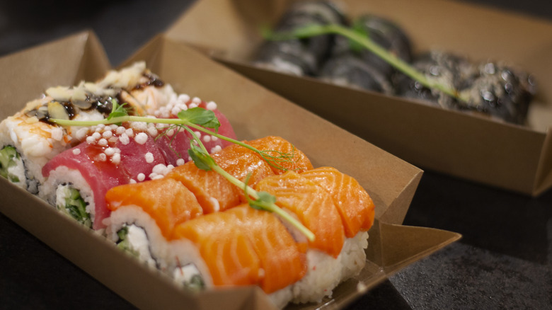 Sushi rolls in a paper carton