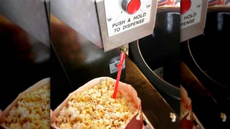 Using straw to get butter from the movie theater dispenser into the middle of the popcorn carton