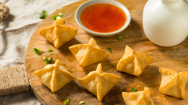 Homemade crab rangoons and a dipping sauce
