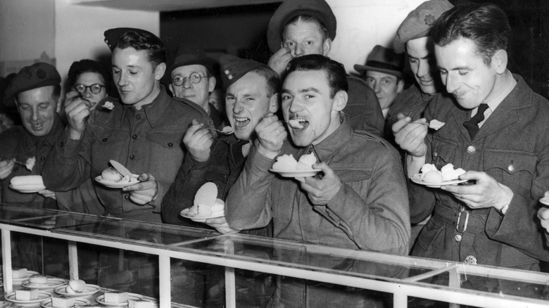 Soldiers during World War II eating cake and ice cream