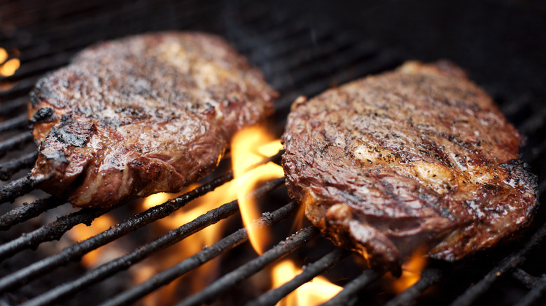 searing steaks on grill