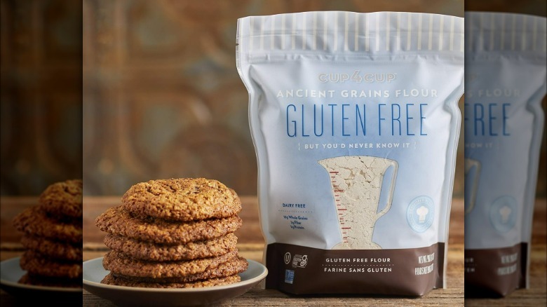 Bag of Cup4Cup Gluten Free Ancient Grains Flour next to a plate of cookies