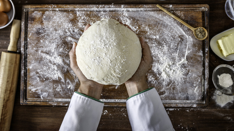chef holding dough
