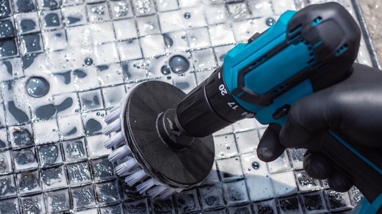 cleaning tile with a drill brush