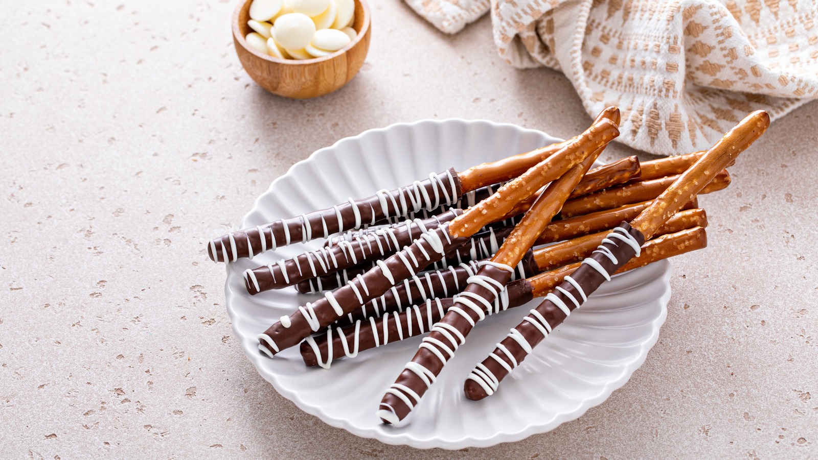 The Hack For Making Chocolate Covered Pretzel Rods Without A Flat Side