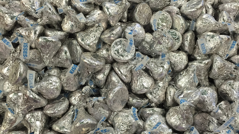 Dozens of silver foil-wrapped Hershey Kisses