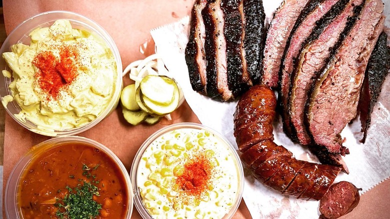Brisket and sausage with creamed corn, beans, and potato salad