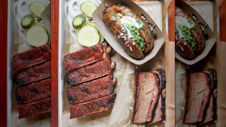 Tray with ribs, brisket, and a baked potato