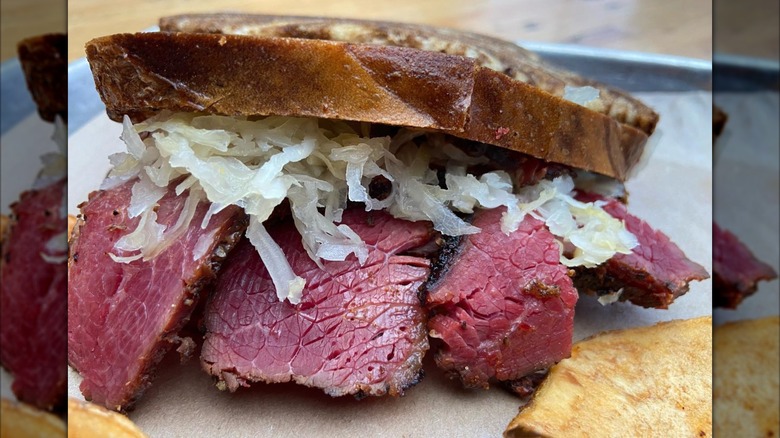 Close-up of a pastrami and sauerkraut sandwich