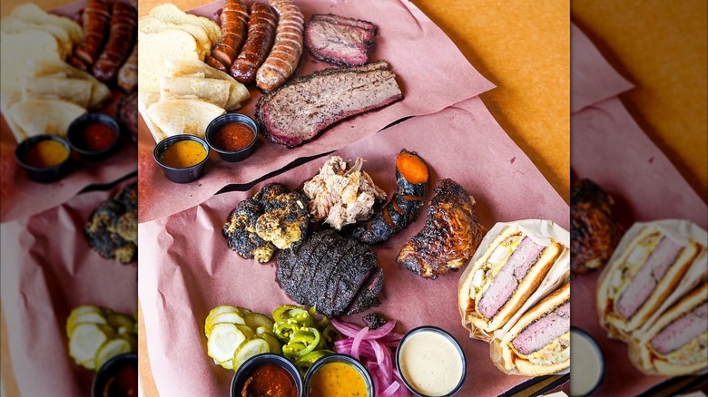 Assortment of BBQ meats and sides on paper
