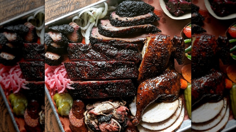 Assortment of BBQ turkey, chicken, brisket, and onions