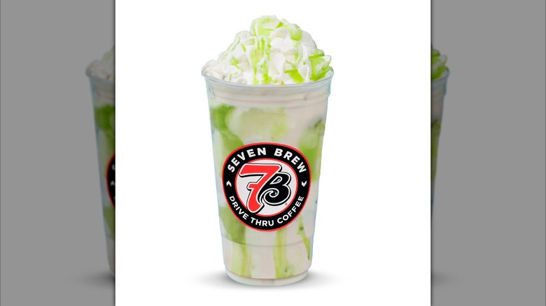 Apple Butter Chai Latte drink with whipped cream from 7 Brew Coffee on white background