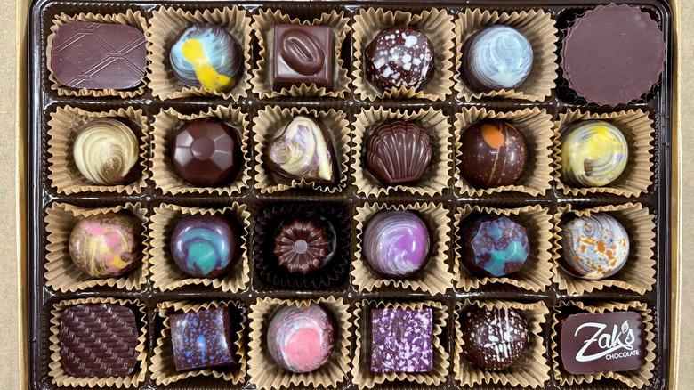 Box containing 24 chocolate confections in various flavors