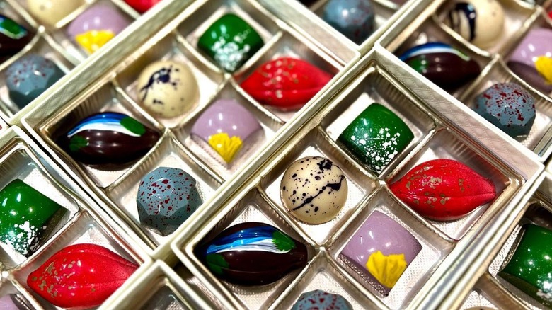Iridescent chocolates in boxes of six