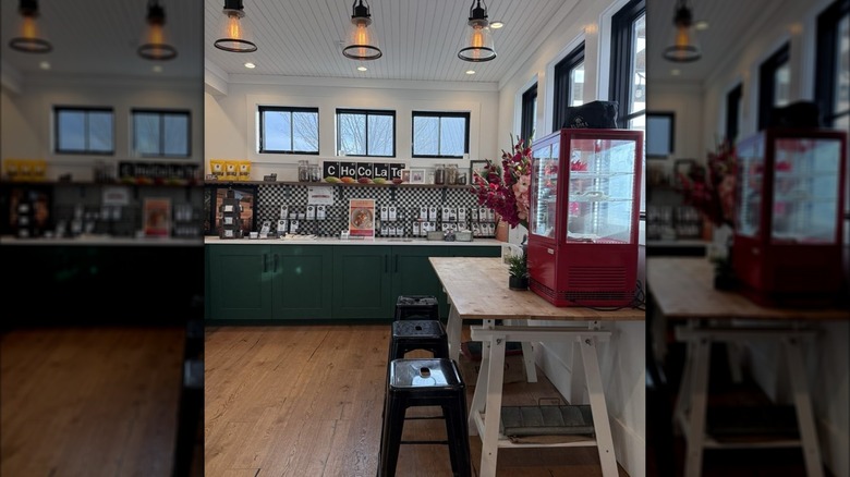 Shop interior with seating area and chocolate bars on display