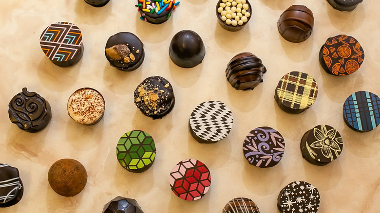 Overhead shot of truffles topped with artistic designs