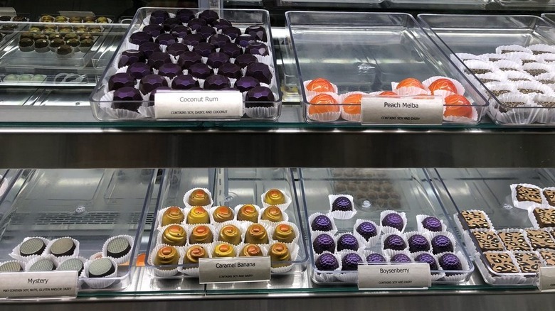 Glass display case with confections in flavors like Coconut Rum, Boysenberry, and Peach Melba