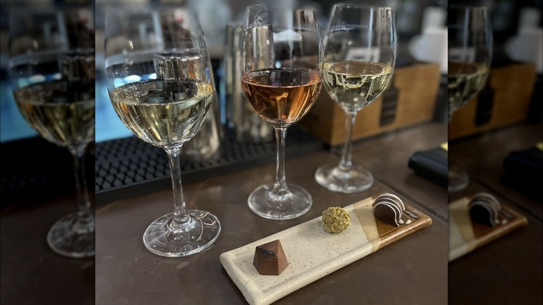 Three glasses of wine paired with three chocolate confections