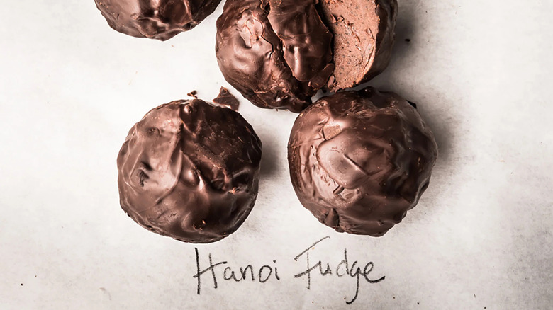 Several balls of Hanoi fudge, one sliced open to show interior