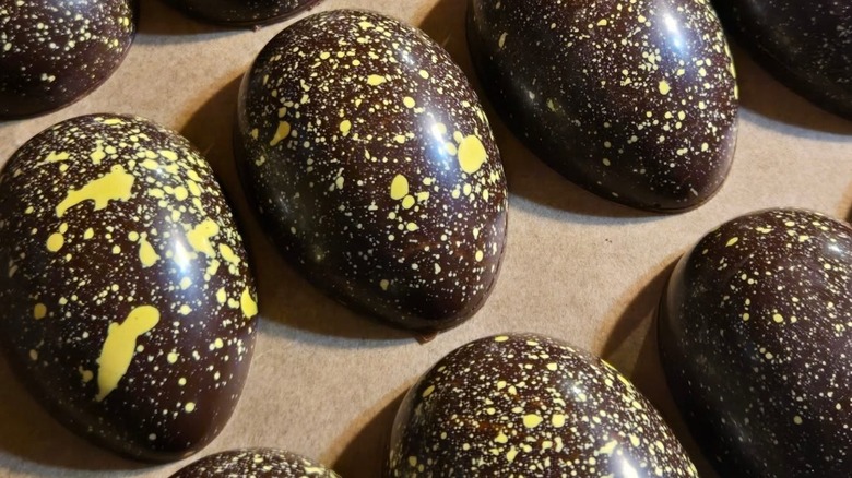 Several sea salt caramel Easter eggs coated in dark chocolate