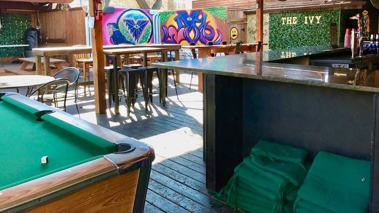 Pool table, bar, and high chairs at The Ivy Tavern