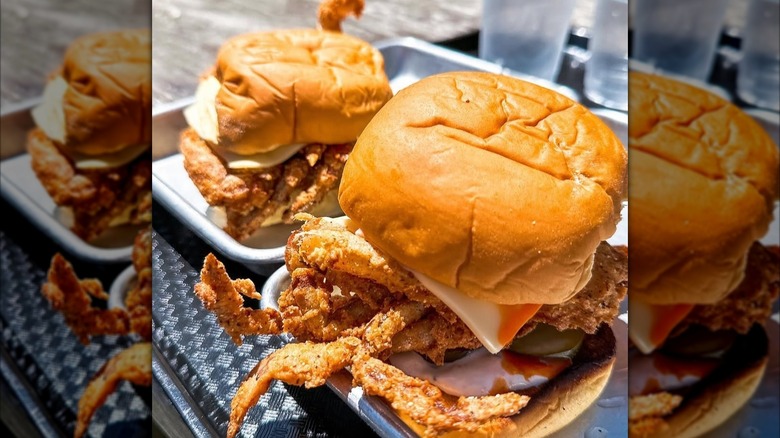 Two fish sandwiches with cheese on bun