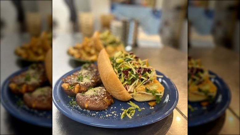 Walleye po'boy on blue plate at The Custer Wolf in South Dakota