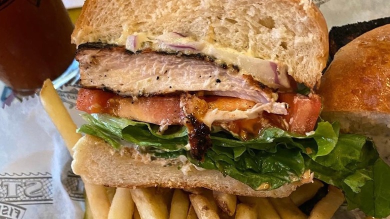 Mahi mahi sandwich with tomato and lettuce