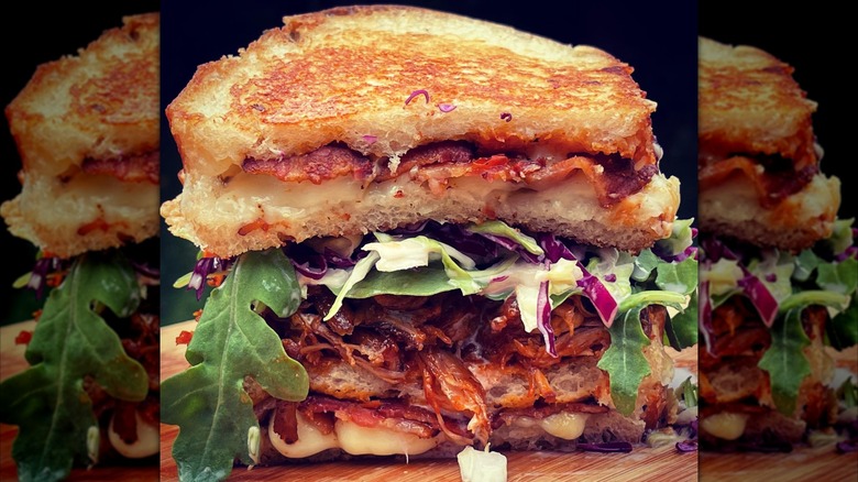 Grilled sandwich with greens and pork