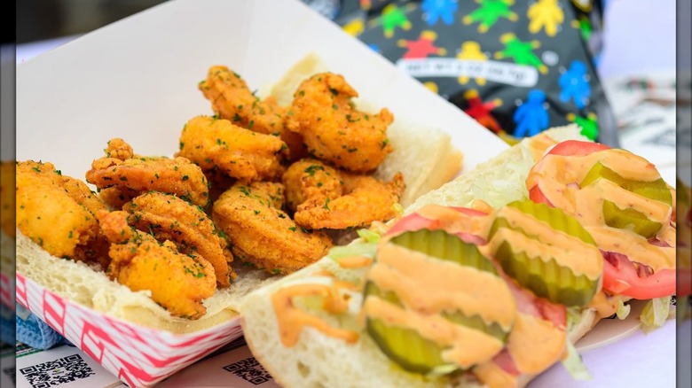 Shrimp po'boy open in halves in container