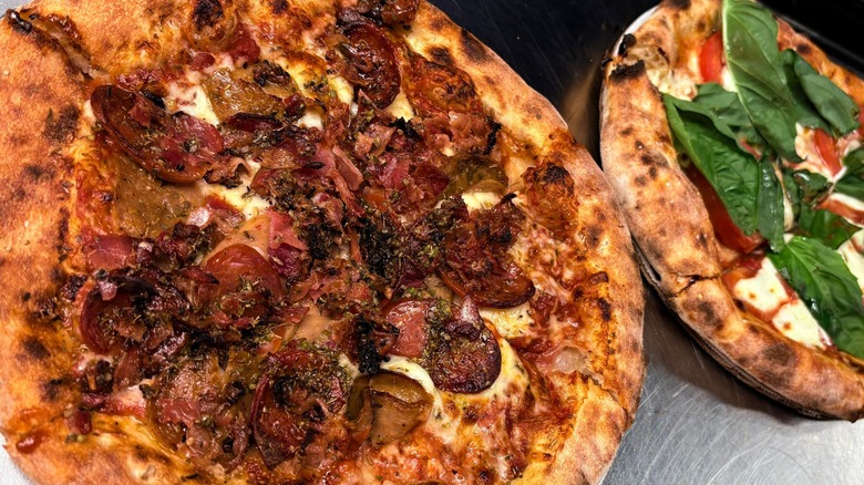 Wood-fired peperoni and margherita pizzas