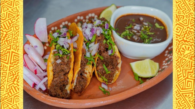 Quesabirria tacos with lime and radish