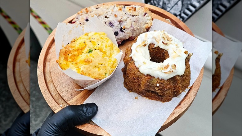 Assortment of pastries on wooden round board