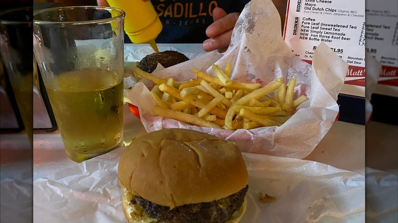 Burger, fries and beer on table at Matt's Bar