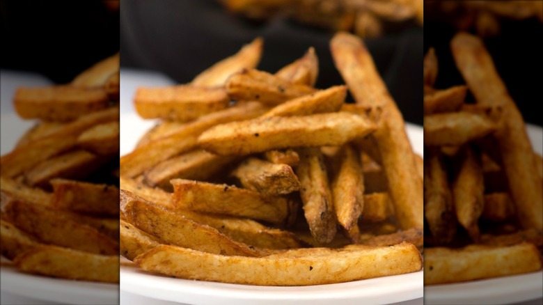 Close-up of fries on white plate