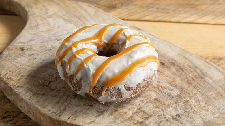 Gluten-free donut on wooden cutting board