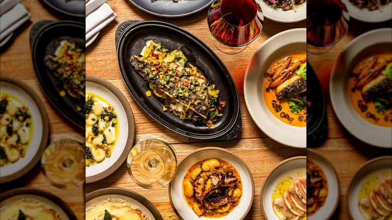 Assortment of Italian dishes on wooden table