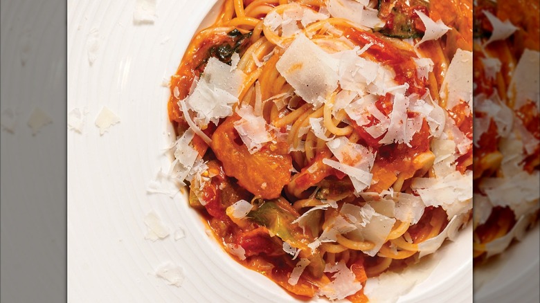 Arrabbiata with shaved parm on white dish