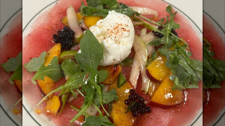 Watermelon salad with peaches and greens