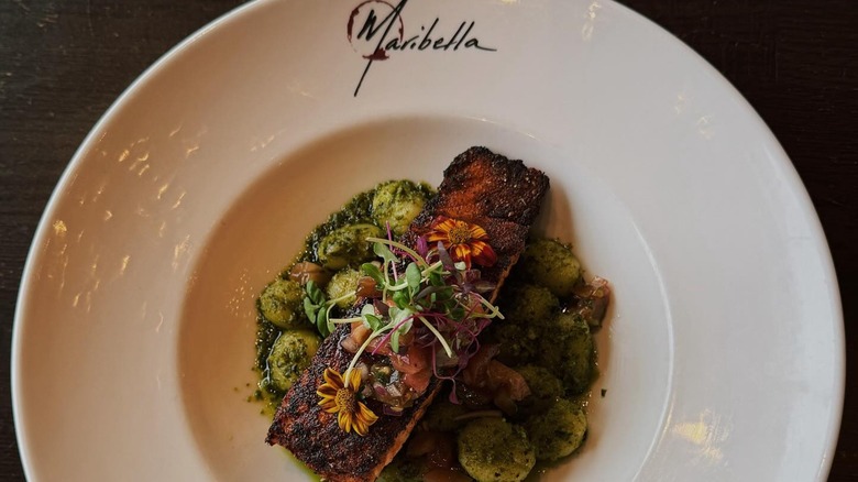 Salmon with pesto dish at Maribella on plate