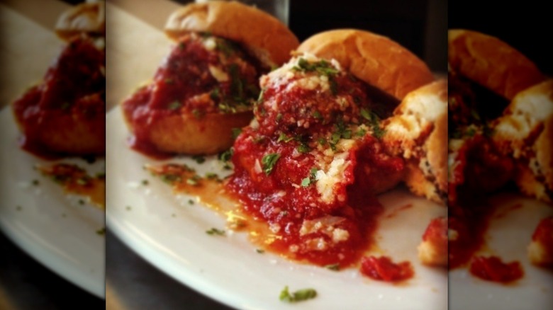 Three meatballs sliders on plate
